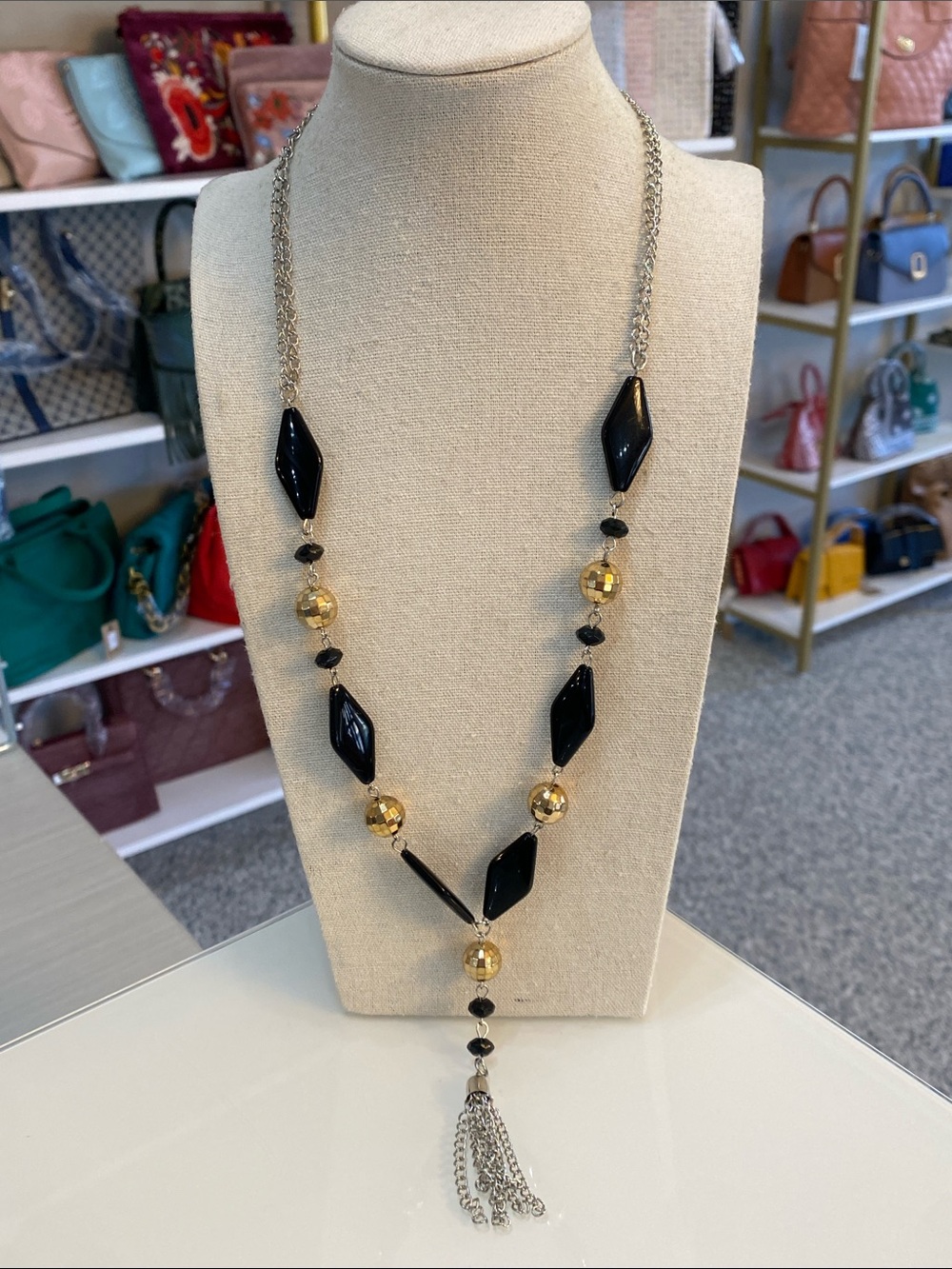 Silver tone black and gold tone tassel necklace